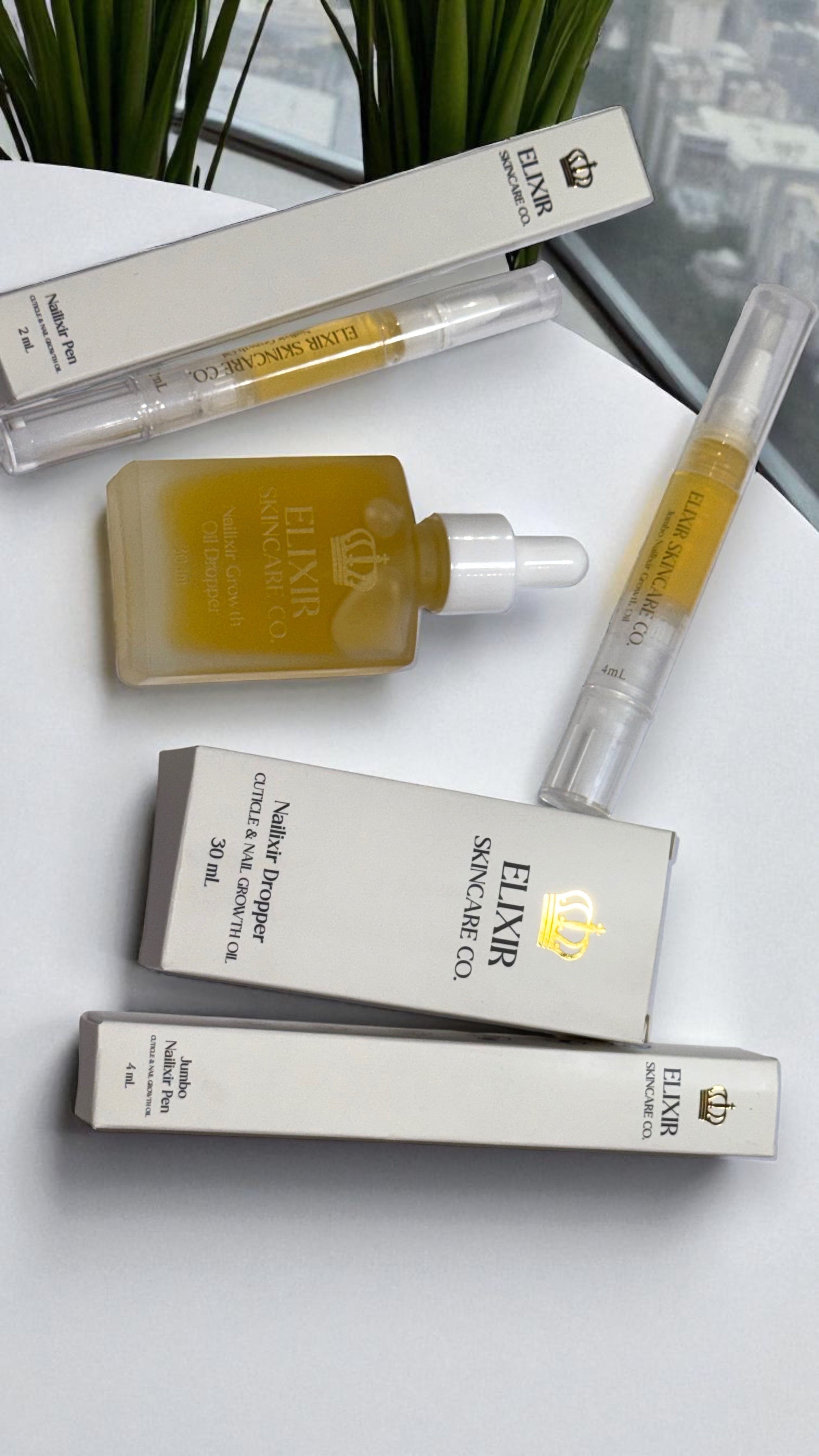 Applying Nailixir Dropper oil to cuticles for hydration