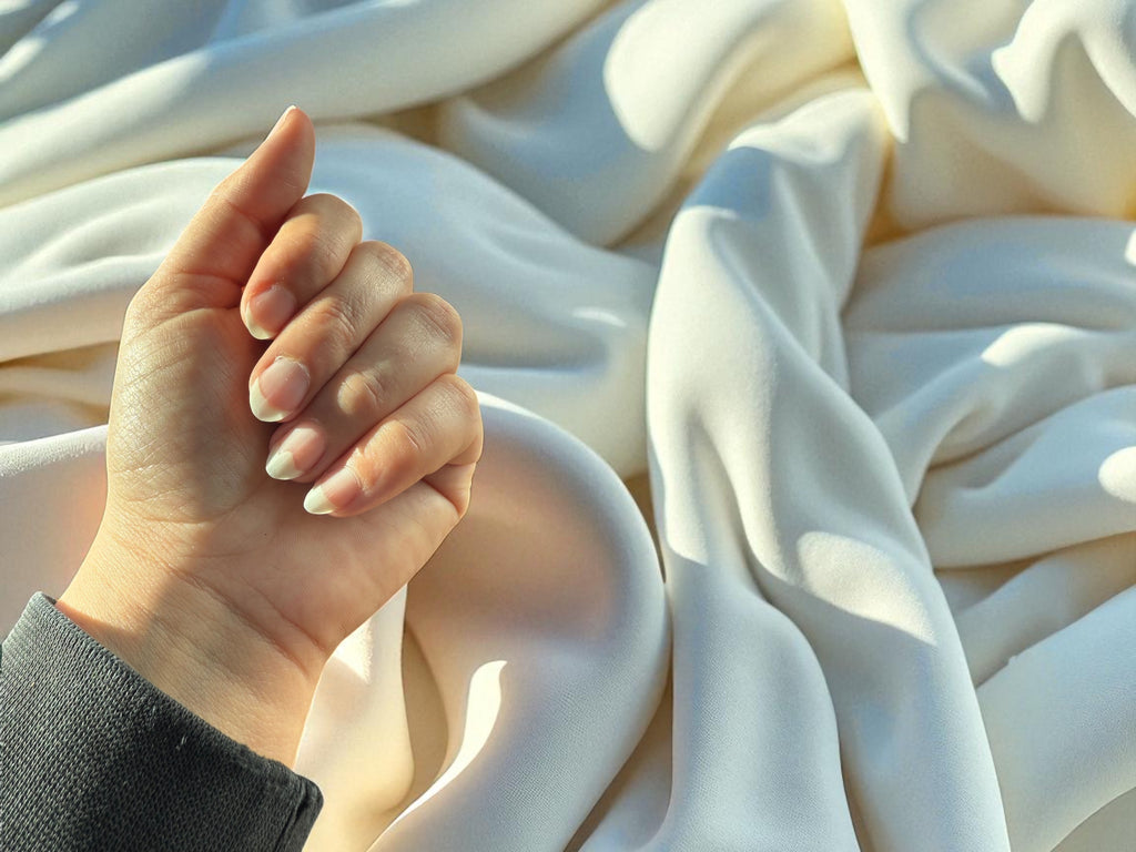 Applying Nailixir Jumbo Pen to cuticles for hydration